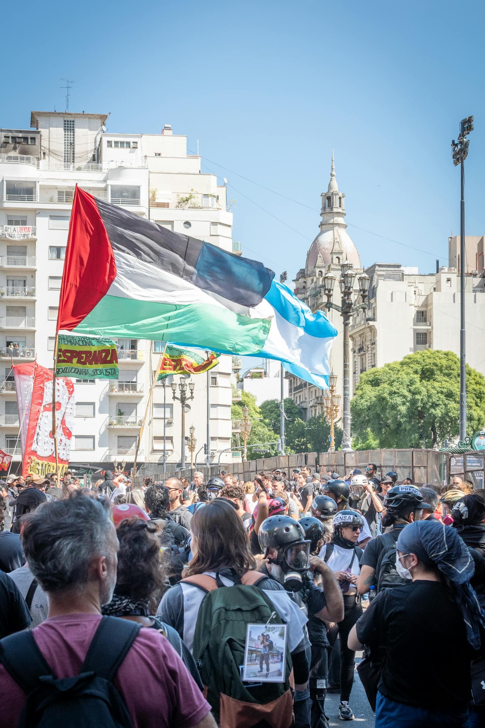 Crowd of protesters waving Argentine flags in Buenos Aires.