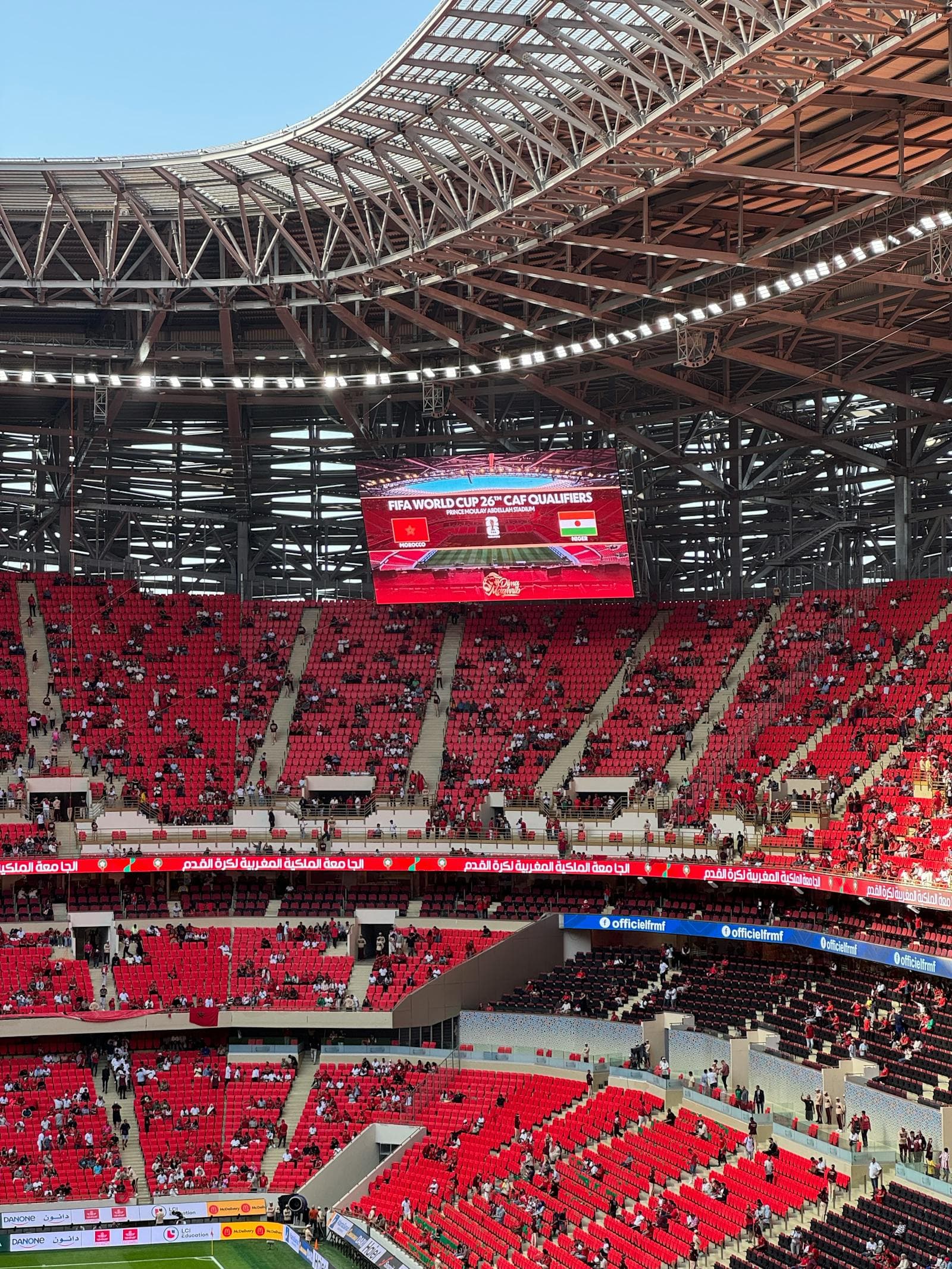 Packed football stadium during a FIFA World Cup qualifying match.