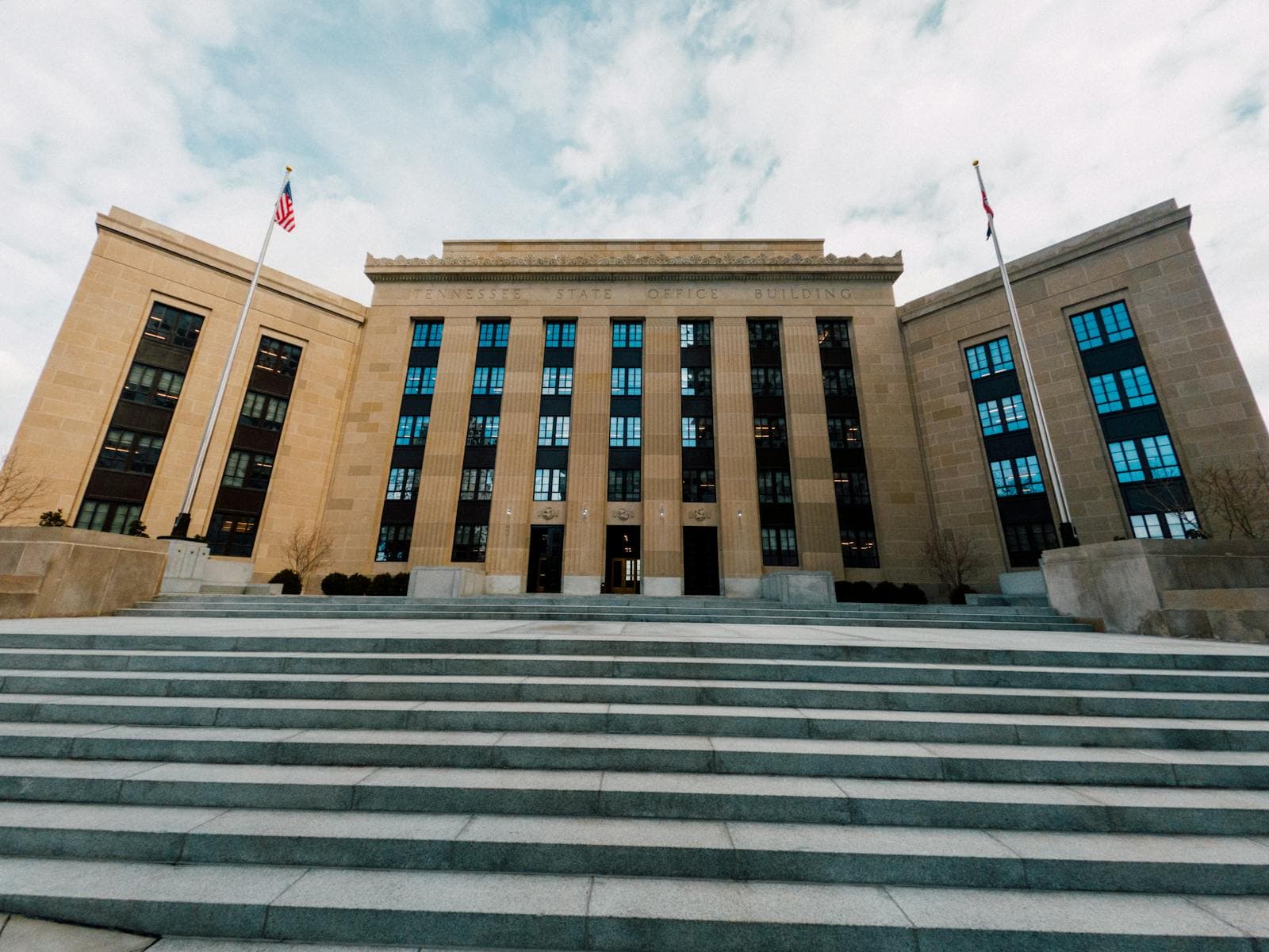 Marriner S. Eccles Federal Reserve building in Washington with US flags.